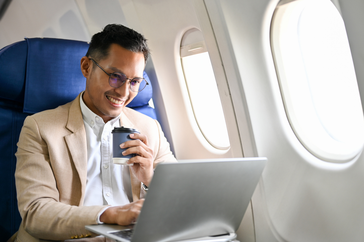 Happy man on plane